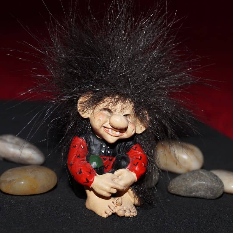 a troll with stones in background