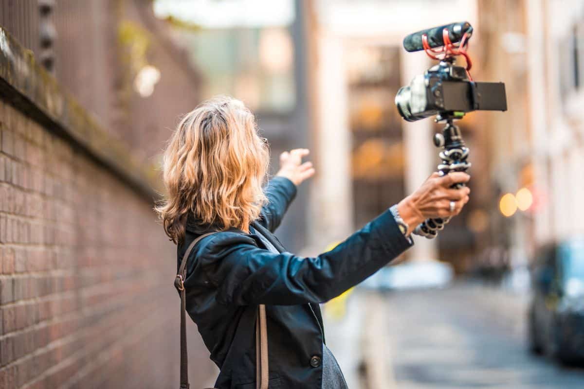 woman vlogging with a canon camera